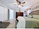 Spacious main bedroom with a ceiling fan, ensuite bathroom, and a large closet for ample storage at 3705 Pine Cir, Lake Wales, FL 33898