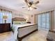 Spacious main bedroom featuring neutral tones, a ceiling fan and ambient lighting at 3705 Pine Cir, Lake Wales, FL 33898