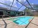 Beautiful in-ground pool in a screened enclosure, perfect for relaxation and outdoor fun at 3705 Pine Cir, Lake Wales, FL 33898
