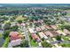 Neighborhood aerial shot highlighting well-maintained landscaping, and tranquil streets at 380 Niblick Cir, Winter Haven, FL 33881