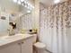 Clean and modern bathroom featuring a shower/tub combo and a large vanity at 380 Niblick Cir, Winter Haven, FL 33881