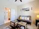 Bedroom featuring a comfortable futon, stylish side tables and neutral decor at 380 Niblick Cir, Winter Haven, FL 33881