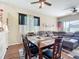 Inviting dining room next to the living room with natural light and a wood dining table at 380 Niblick Cir, Winter Haven, FL 33881