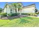 Beautiful home with a well-maintained lawn and mature palm trees at 380 Niblick Cir, Winter Haven, FL 33881