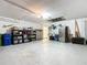 Well-organized garage with storage shelves and tools, offering plenty of room at 380 Niblick Cir, Winter Haven, FL 33881