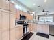 Well-equipped kitchen featuring modern appliances and ample cabinetry at 380 Niblick Cir, Winter Haven, FL 33881