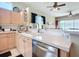 Bright kitchen with stainless steel appliances and a view to the living area at 380 Niblick Cir, Winter Haven, FL 33881