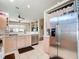 Modern kitchen with stainless steel appliances and a view of the living room at 380 Niblick Cir, Winter Haven, FL 33881