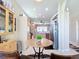 Kitchen features light wood cabinets, modern appliances, and an open design with a view to the dining area at 380 Niblick Cir, Winter Haven, FL 33881