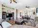 View of a spacious living room and kitchen area, perfect for Gathering gatherings at 380 Niblick Cir, Winter Haven, FL 33881