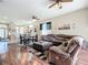 Open concept living room showing the kitchen, dining area and comfortable furniture, great for entertaining at 380 Niblick Cir, Winter Haven, FL 33881