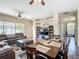 Cozy living room featuring a entertainment center, recessed lighting and wood floors throughout at 380 Niblick Cir, Winter Haven, FL 33881