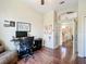 Well-lit office space with a computer desk, ergonomic chair and laminate flooring at 380 Niblick Cir, Winter Haven, FL 33881