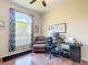 Bright home office features a work station and a comfortable reading chair at 380 Niblick Cir, Winter Haven, FL 33881