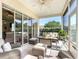Comfortable screened patio with a ceiling fan, offers a relaxing outdoor living space at 380 Niblick Cir, Winter Haven, FL 33881