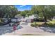 This aerial view showcases the home's brick facade, carport, and proximity to neighboring properties at 40 Westridge Rd, Davenport, FL 33837