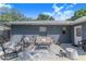 Cozy patio area with comfortable seating, perfect for enjoying the outdoors in this well-maintained backyard at 40 Westridge Rd, Davenport, FL 33837