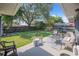 Spacious backyard featuring a patio with comfortable seating and a lush lawn, perfect for outdoor gatherings at 40 Westridge Rd, Davenport, FL 33837