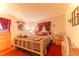 Relaxing bedroom features natural wood accents and warm, inviting decor at 40 Westridge Rd, Davenport, FL 33837