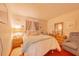 Serene bedroom with soft colors, plush bedding, and cozy reading chair at 40 Westridge Rd, Davenport, FL 33837