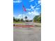 Community entrance sign flying the American flag for all residents and visitors to see at 40 Westridge Rd, Davenport, FL 33837