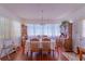 Formal dining room with hardwood floors, classic chandelier, and charming wood furniture at 40 Westridge Rd, Davenport, FL 33837
