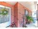 Charming front porch adorned with greenery, decorative wreaths and ample seating for relaxation at 40 Westridge Rd, Davenport, FL 33837
