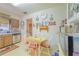 Eat-in kitchen features stainless steel dishwasher, wooden cabinetry and charming decor at 40 Westridge Rd, Davenport, FL 33837