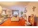 Bright living room featuring comfortable couches, carpet, and plenty of space for relaxation and entertaining at 40 Westridge Rd, Davenport, FL 33837