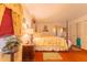 Comfortable main bedroom features warm lighting, floral bedding and natural decor at 40 Westridge Rd, Davenport, FL 33837