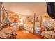 Cozy main bedroom with four-poster bed, floral accents, and soft lighting at 40 Westridge Rd, Davenport, FL 33837