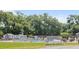 Outdoor community pool area with lounge chairs, shaded spots, and lush greenery, perfect for relaxation and recreation at 40 Westridge Rd, Davenport, FL 33837