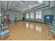 Bright activity room with tile floors, ceiling fans, large windows, and multiple chairs at 4100 Martindale Loop, Winter Haven, FL 33884