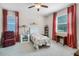 Cozy bedroom with a floral comforter and comfortable sitting area at 4100 Martindale Loop, Winter Haven, FL 33884