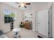 Comfortable bedroom featuring a ceiling fan and a window that provides natural light at 4100 Martindale Loop, Winter Haven, FL 33884
