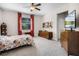 Comfortable bedroom featuring carpet and a ceiling fan at 4100 Martindale Loop, Winter Haven, FL 33884