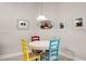 Bright breakfast nook features whimsical chairs and a decorative coffee theme at 4100 Martindale Loop, Winter Haven, FL 33884