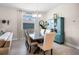 Open-concept dining room with modern table, chairs, and ample natural light at 4100 Martindale Loop, Winter Haven, FL 33884