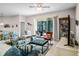 Bright living room with sliders to outdoor patio, ceiling fan, and comfortable furnishings at 4100 Martindale Loop, Winter Haven, FL 33884