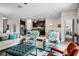 Open-concept living room, with modern furnishings seamlessly connecting to the kitchen area at 4100 Martindale Loop, Winter Haven, FL 33884