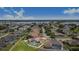 Property with a screened pool area and a large backyard, situated in a neighborhood near a tranquil lake at 413 Ruby Lake Pl, Winter Haven, FL 33884