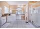 A beautifully lit bathroom featuring both a glass enclosed walk-in shower and a soaking tub for relaxation at 413 Ruby Lake Pl, Winter Haven, FL 33884