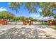 Welcoming gated community entrance with brick columns, lush greenery, and a well-maintained landscape at 413 Ruby Lake Pl, Winter Haven, FL 33884