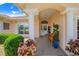 Inviting front porch with brick walkway, decorative columns, and manicured landscaping creating a warm welcome at 413 Ruby Lake Pl, Winter Haven, FL 33884