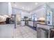 Modern kitchen with white cabinets, stainless steel appliances, and granite countertops, ready for culinary adventures at 413 Ruby Lake Pl, Winter Haven, FL 33884