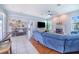 Open-concept living room featuring modern furnishings, fireplace, and a stylish bar area for entertaining guests at 413 Ruby Lake Pl, Winter Haven, FL 33884