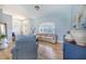 Inviting living room with hardwood floors, large window, and comfortable seating arrangement at 413 Ruby Lake Pl, Winter Haven, FL 33884