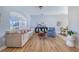 Cozy living room with wood floors, modern furniture, and ample natural light creating a warm and inviting space at 413 Ruby Lake Pl, Winter Haven, FL 33884