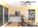 Outdoor kitchen and bar area on the patio with bar seating and cabinets for storage at 413 Ruby Lake Pl, Winter Haven, FL 33884