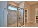 Bathroom featuring a tiled walk-in shower with glass doors and modern fixtures at 421 Riders Loop, Auburndale, FL 33823